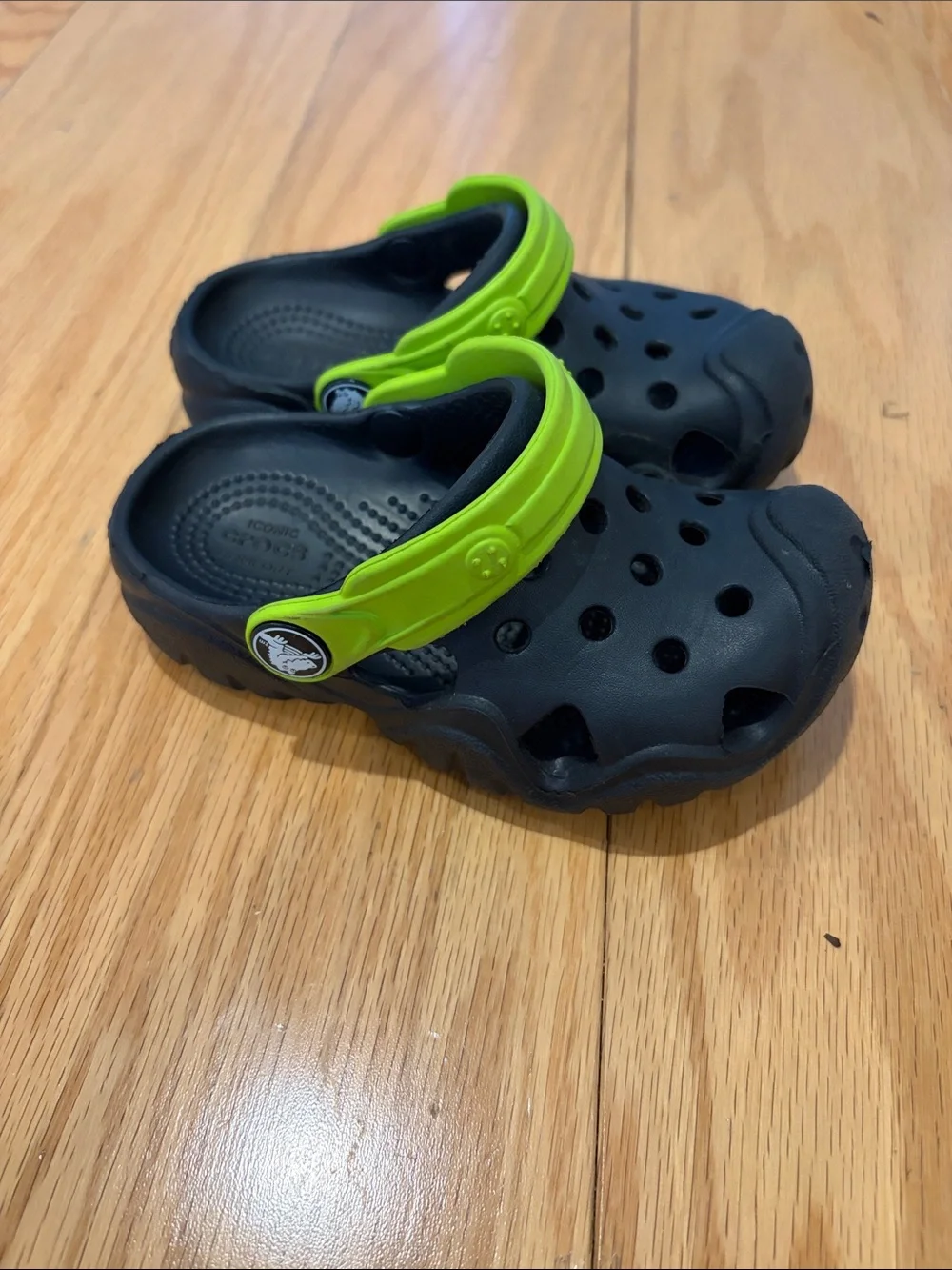 CROCS Kids Black Clogs with Bright Green Heel Strap